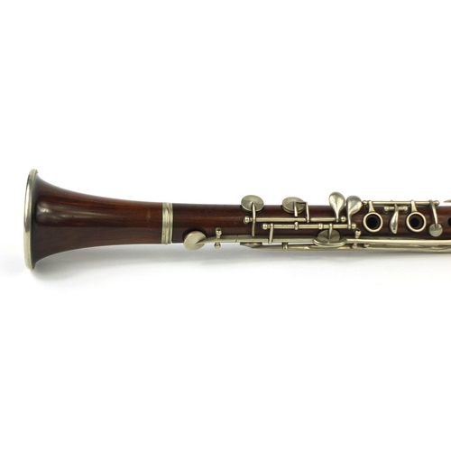 235 - Butler Hey Market of London four piece rosewood clarinet with nickel mounts, impressed marks, 69 cm ... 