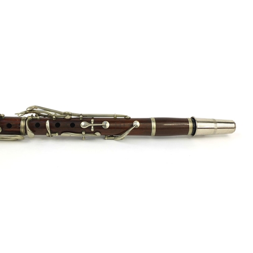 235 - Butler Hey Market of London four piece rosewood clarinet with nickel mounts, impressed marks, 69 cm ... 