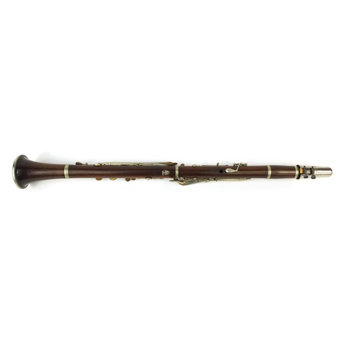 235 - Butler Hey Market of London four piece rosewood clarinet with nickel mounts, impressed marks, 69 cm ... 