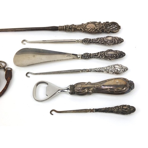 2298 - Silver items including silver handled button hook, bottle opener, silver H E Peck of London pocket w... 