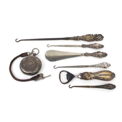 2298 - Silver items including silver handled button hook, bottle opener, silver H E Peck of London pocket w... 