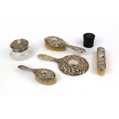 2296 - Five silver mounted vanity items together with an ebonised cylindrical pot with silver initial, the ... 