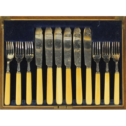 2063 - Bravingtons Six place canteen of silver plated fish knives and forks, with ivory handles