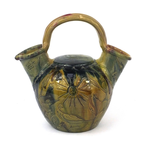 509 - Green glazed pottery vessel incised with birds and flowers, 28cm high