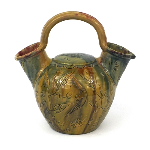 509 - Green glazed pottery vessel incised with birds and flowers, 28cm high