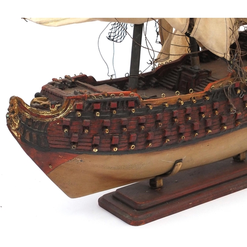 575 - Wooden model of a galleon, 70cm long