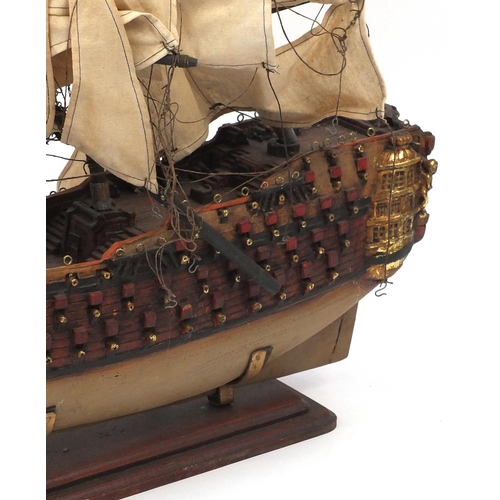 575 - Wooden model of a galleon, 70cm long