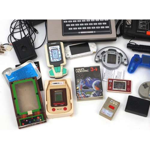 338 - Assorted vintage games and games consoles including Videopac computer, a Mario cement factory game a... 