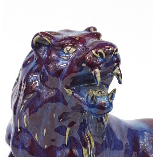 517 - Large Chinese purple glazed lion, 31cm high