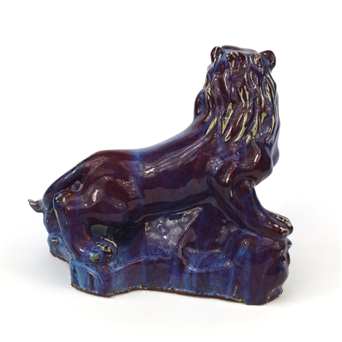 517 - Large Chinese purple glazed lion, 31cm high