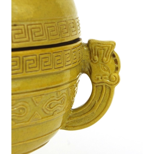 510 - Chinese porcelain yellow glazed Gui vessel and cover with elephant head handles, the lid decorated i... 