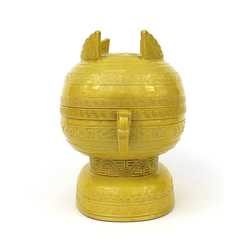 510 - Chinese porcelain yellow glazed Gui vessel and cover with elephant head handles, the lid decorated i... 