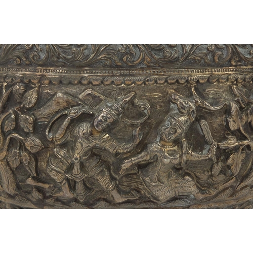 609 - Burmese silver bowl profusely embossed with figures amongst tress, within foliate boarders, stamp ma... 