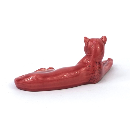 720 - Mintons pink glazed reclining panther, factory marks to the base, 21cm in length