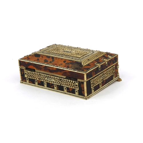 628 - 19th century Anglo Indian tortoiseshell and bone mounted casket, on paw feet, the pierced bone panel... 