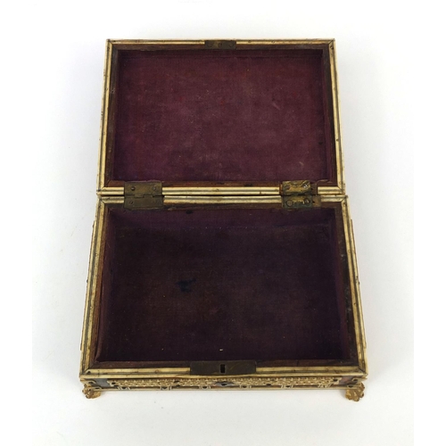 628 - 19th century Anglo Indian tortoiseshell and bone mounted casket, on paw feet, the pierced bone panel... 