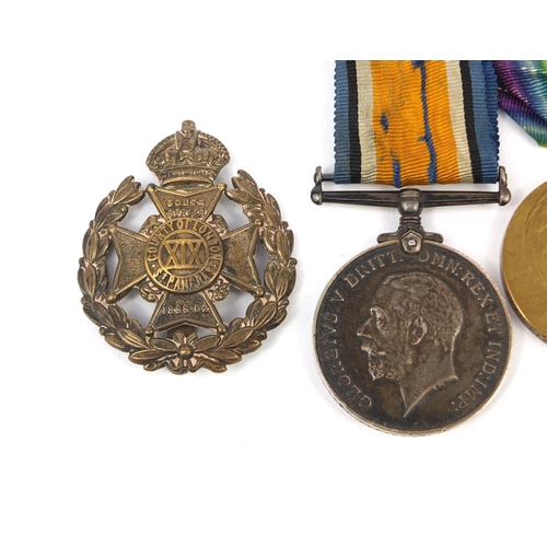 251 - World War I British Military Victory and 1914-18 War medal with two London cap badges and a 9ct gold... 