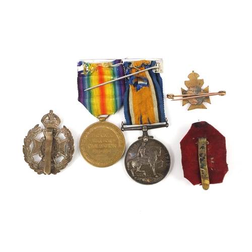 251 - World War I British Military Victory and 1914-18 War medal with two London cap badges and a 9ct gold... 