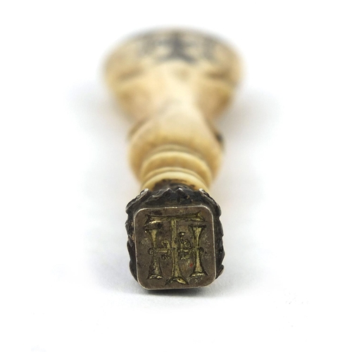 102 - Antique ivory handled seal, the handle and seal with H T D C initials, 8cm in length