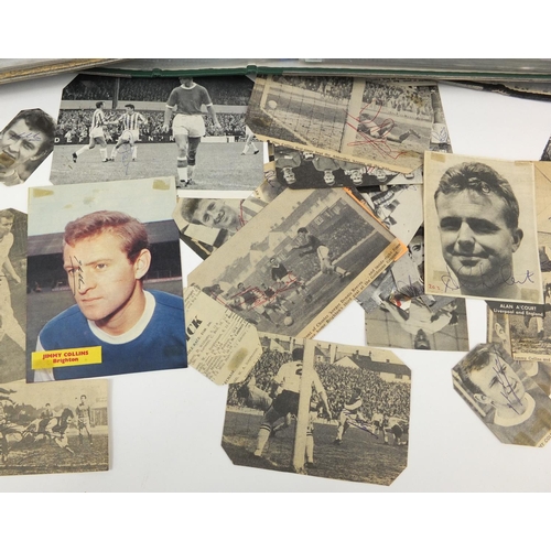 148 - Extensive collection of football autographs, housed in three albums all signed on newspaper clipping... 