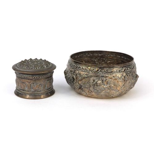 613 - Burmese silver bowl and cylindrical box and cover, both embossed with creatures and floral motifs, t... 