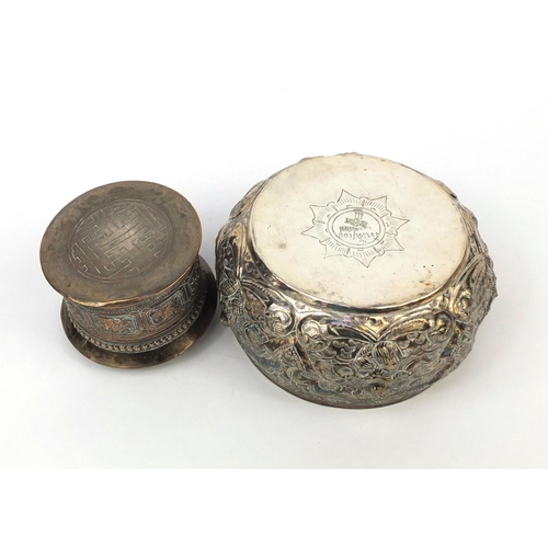 613 - Burmese silver bowl and cylindrical box and cover, both embossed with creatures and floral motifs, t... 