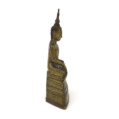 603 - Antique Thai bronze seated figure of Buddha, script to the reverse, 26cm high