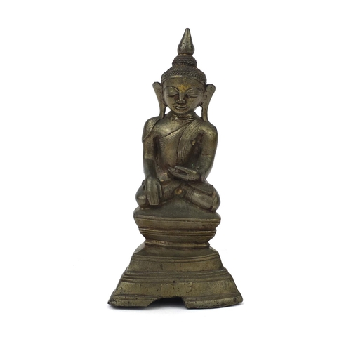 604 - Antique Thai patinated bronze seated figure of Buddha, script to the reverse, 18.5cm high