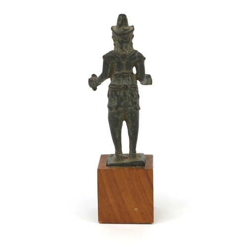 607 - Antique Thai Bronze figure raised on a later wooden base, overall 15.5cm high