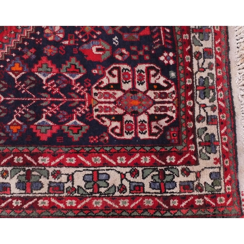 2008 - Rectangular Persian Qashqai rug, the central field decorated with animals and floral motifs onto a p... 