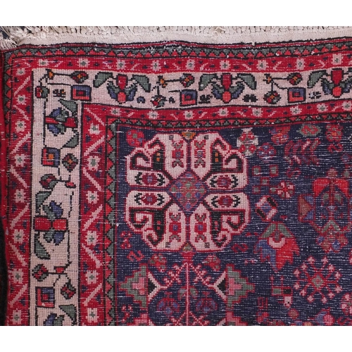 2008 - Rectangular Persian Qashqai rug, the central field decorated with animals and floral motifs onto a p... 