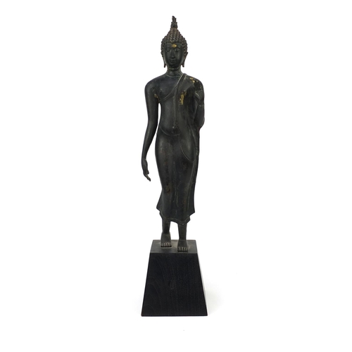 606 - Thai patinated bronze standing figure of Buddha, on wooden stand, overall 68cm high