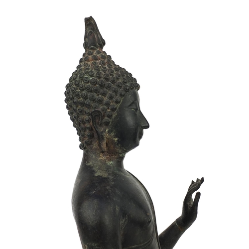 606 - Thai patinated bronze standing figure of Buddha, on wooden stand, overall 68cm high