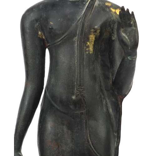 606 - Thai patinated bronze standing figure of Buddha, on wooden stand, overall 68cm high