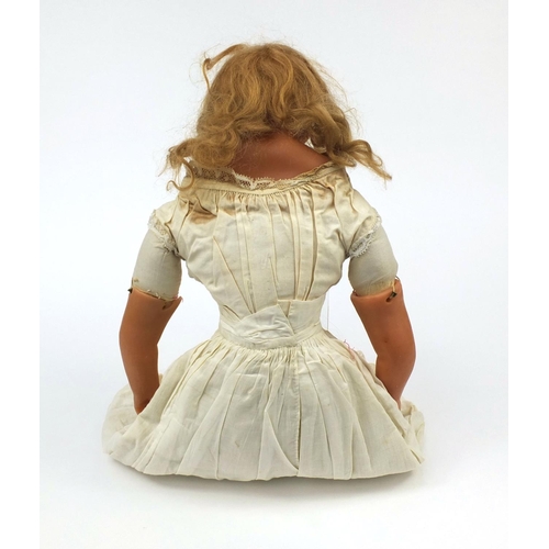 372 - 19th century wax headed doll with wax limbs wearing a lace dress and leather shoes, overall 63cm in ... 