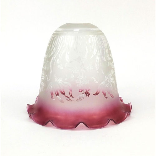 699 - Cranberry and clear glass shade etched with stylised flowers, 19cm high