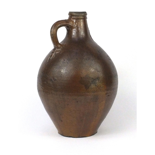 671 - Large antique Bellarmine pottery jug, with incised mask and seals, 39cm high