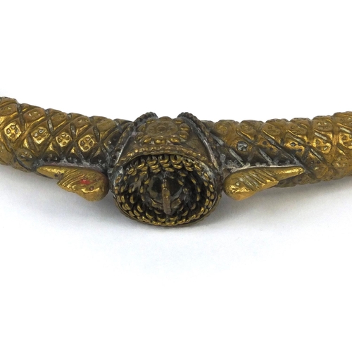 646 - Middle Eastern brass torc, 19.5cm in length