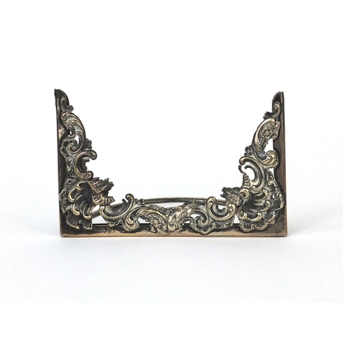 857 - Silver menu holder with embossed decoration, C.D London 1901, 11.5cm long, approximate weight 53.2g