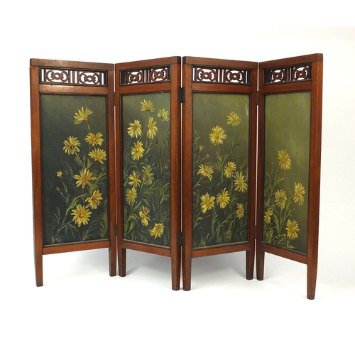 777 - Aesthetic walnut four fold screen with foliate fret work panels above four rectangular panels, each ... 