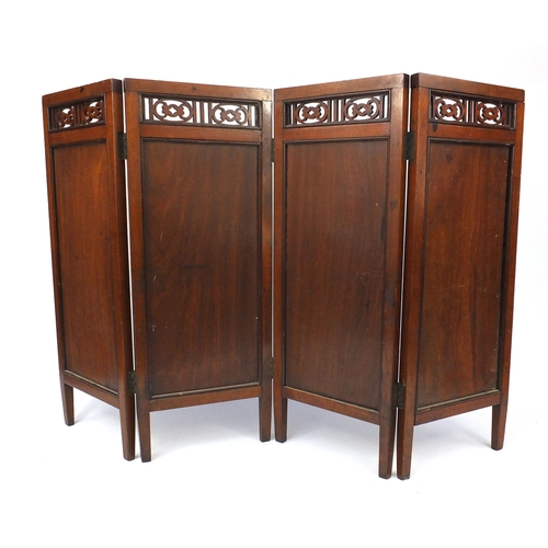 777 - Aesthetic walnut four fold screen with foliate fret work panels above four rectangular panels, each ... 