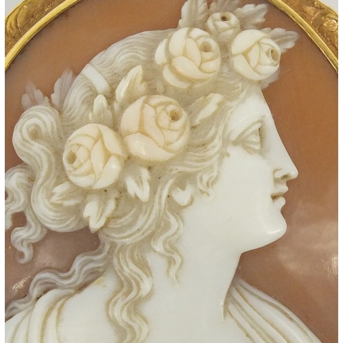 933 - Large cameo maiden head brooch with gold coloured metal mount, indistinct impressed marks to the rev... 