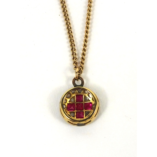 928 - Unmarked gold diamond and ruby red cross pendant, with a 9ct gold necklace, the pendant made for a m... 