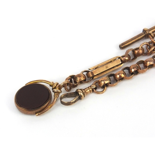 914 - Victorian 9ct gold watch chain with 9ct gold hard stone spinner fob, 38cm long, approximate weight 4... 