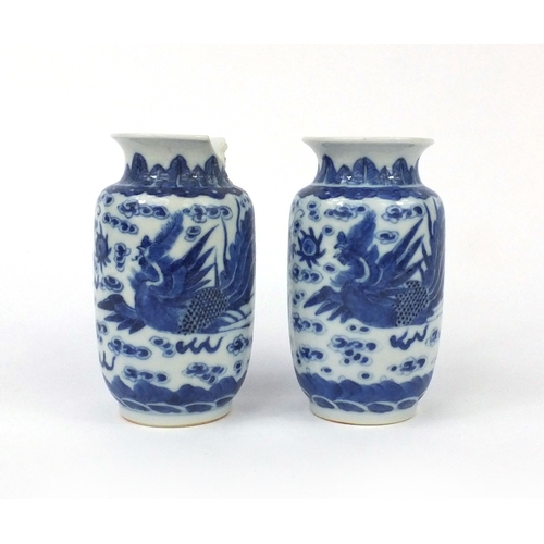 501 - Pair of Chinese blue and white porcelain vases, both hand painted with phoenixes and dragons chasing... 