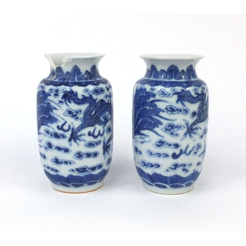 501 - Pair of Chinese blue and white porcelain vases, both hand painted with phoenixes and dragons chasing... 