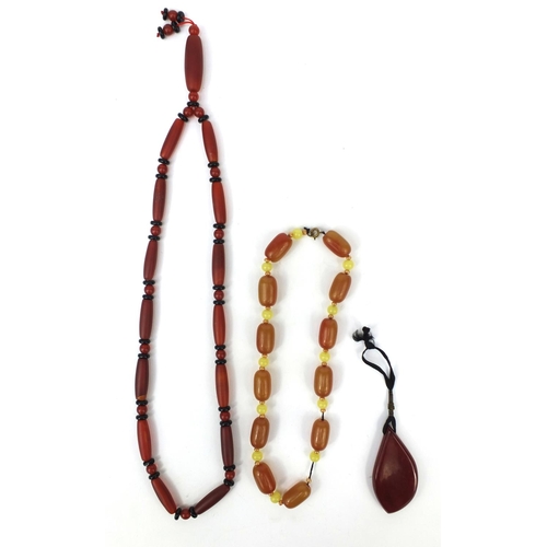 361 - Assorted jewellery comprising an amber coloured necklace, red glass bead necklace and a pendant