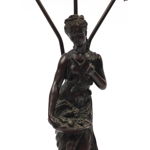 181 - Bronze style figural table lamp with floral frosted glass shades, 82cm high