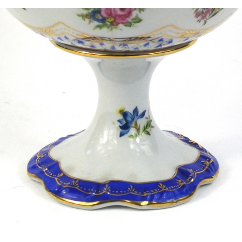 253 - Porcelain pedestal fruit bowl transfer printed with flowers and hand gilded, 20cm high x 28cm in dia... 