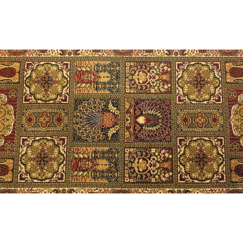 114 - Green and brown ground carpet runner and rug, the rug approximately 180cm x 90cm